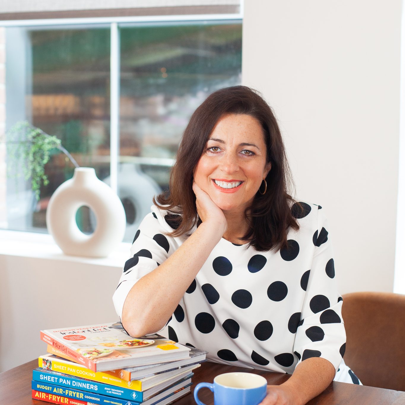 Jenny Tschiesche, nutritionist and bestselling author pictured with her cookbooks.